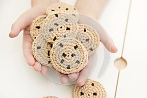 Handmade crochet cookies with chocolate chips.