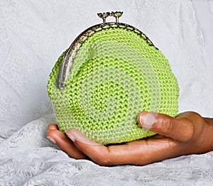 Handmade crochet purse with cotton thread in yellow color photo