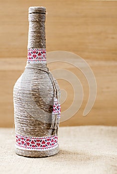 Handmade decorated bottle, with twine