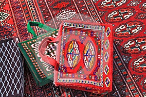 Handmade decorative bags and carpets with traditional ornament. Turkmenistan. Ashkhabad market