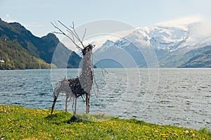 The handmade deer on a fjords shore