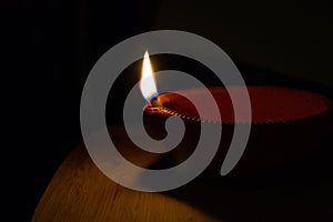 Handmade Diwali diya and flame