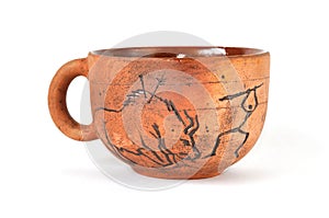 Handmade earthenware cup in ancient art style