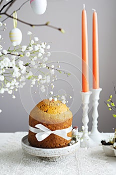 Handmade easter cake with white flowers and decor on table