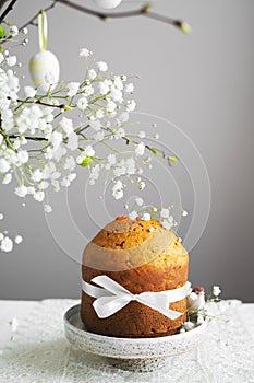 Handmade easter cake with white flowers and decor on table