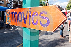 Handmade Festival Sign Says Movies And Points In Right Direction