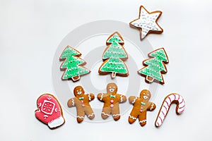 Handmade festive gingerbread cookies in the form of stars, snowflakes, people, socks, staff, mittens, Christmas trees, hearts for