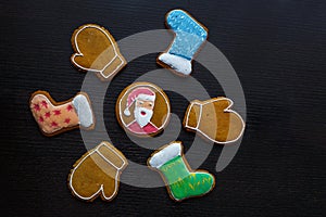 Handmade festive gingerbread cookies in the form of stars, snowflakes, people, socks, staff, mittens, Christmas trees, hearts for