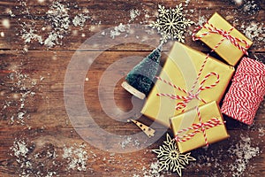 handmade gift boxes over snowy wooden table