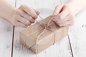 Handmade gift pcking in craft papper by female