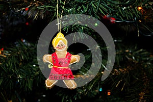 Handmade Gingerbread Girl Christmas Ornament on a Christmas Tree