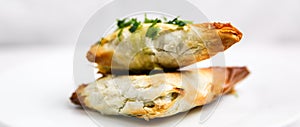 Handmade Greek Spinach and Feta Cheese Phyllo Spanakopita on white plate