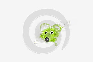 Handmade green glass mouse on white background