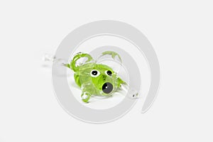 Handmade green glass transparent mouse on white background