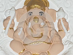 Handmade Hindu Lord Ganesh. Close up. Crafted Clay Model of Ganesha Statue depicts a calm and composed posture of the lord. A DIY