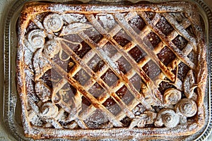 Handmade jam pie on an iron tray