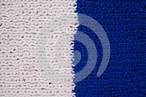 Handmade knitted fabric blue and white wool background texture