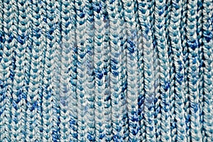 Handmade knitted fabric blue wool background texture