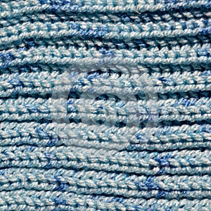 Handmade knitted fabric blue wool background texture