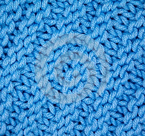 Handmade knitted fabric blue wool background texture