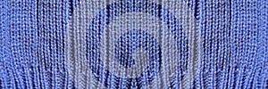 Handmade knitted fabric blue wool background texture