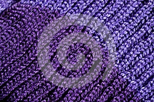 Handmade knitted fabric purple wool background texture