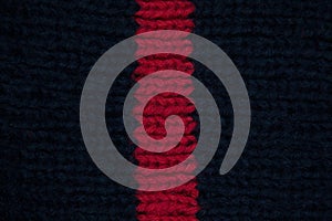 Handmade knitted fabric red and navy wool background texture
