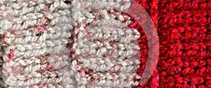 Handmade knitted fabric red and white wool background texture