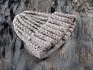 Handmade knitted hat made of gray wool for a woman