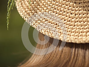 Handmade knitted hat with raffia photo