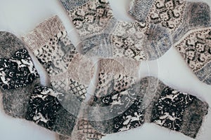 Handmade knitted socks for the cold season. View from above. Many different blue color socks.