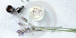 Handmade lavender scented candle with essential oil, flowers, wax and wicks, panoramic flat lay