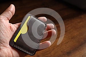 Leather card holder in hand
