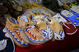 Handmade leather Native American Indian moccasins at a powwow in San Francisco photo