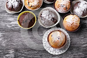 Handmade muffins close up on a black wooden table