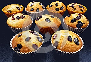 Handmade muffins isolated on black background