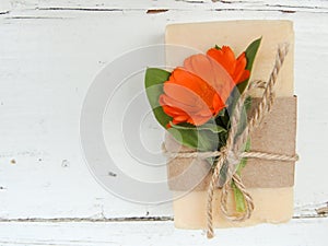 Handmade natural bath spa calendula soap on vintage wooden background. Soap making. Soap bars.