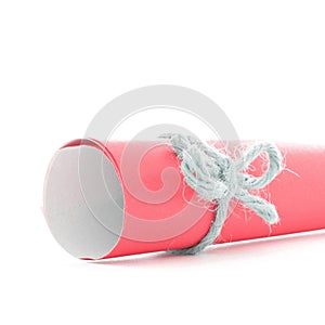 Handmade natural cord node tied on red paper scroll isolated