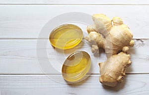 Handmade natural honey ginger soap on white wood background