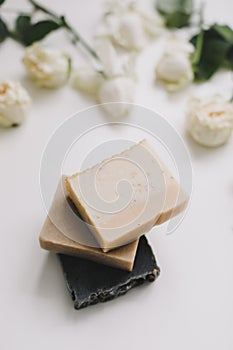 Handmade natural soap on white floral background. Soap making. Soap bars. Spa, skin care. Natural Organic spa cosmetic