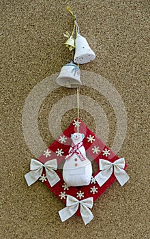 Handmade New Year talisman obereg with snowman and bells