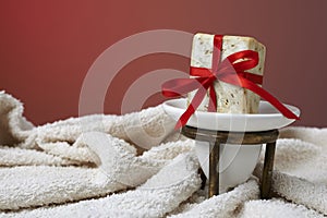 Handmade olive soap with a towel, as a gift.