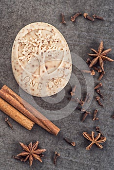 Handmade ornamental soap with cinnamons and anise n black background, product of cosmetics and body care