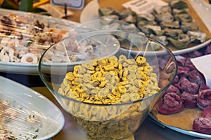 Handmade pastas displayed on the shop window of an Italian pasta store in Milan, Italy