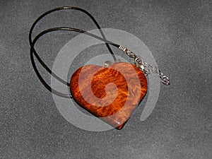 Handmade pendant with sucupira wood pendant close-up photo