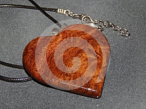 Handmade pendant with sucupira wood pendant close-up photo