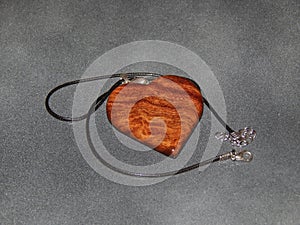 Handmade pendant with sucupira wood pendant close-up photo