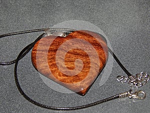 Handmade pendant with sucupira wood pendant close-up photo