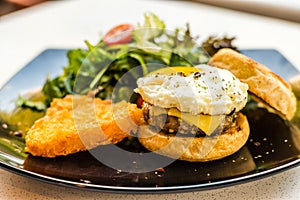 Handmade pork sausage  patty, egg, cheddar, Japanese wheat flour and Taiwan longan blossom honey muffin, with mesclun and crispy