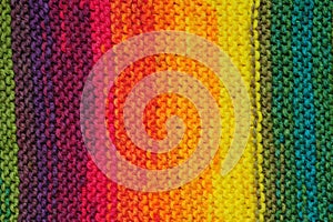 Handmade rainbow colored seamless knitted patterns texture with vertical rows